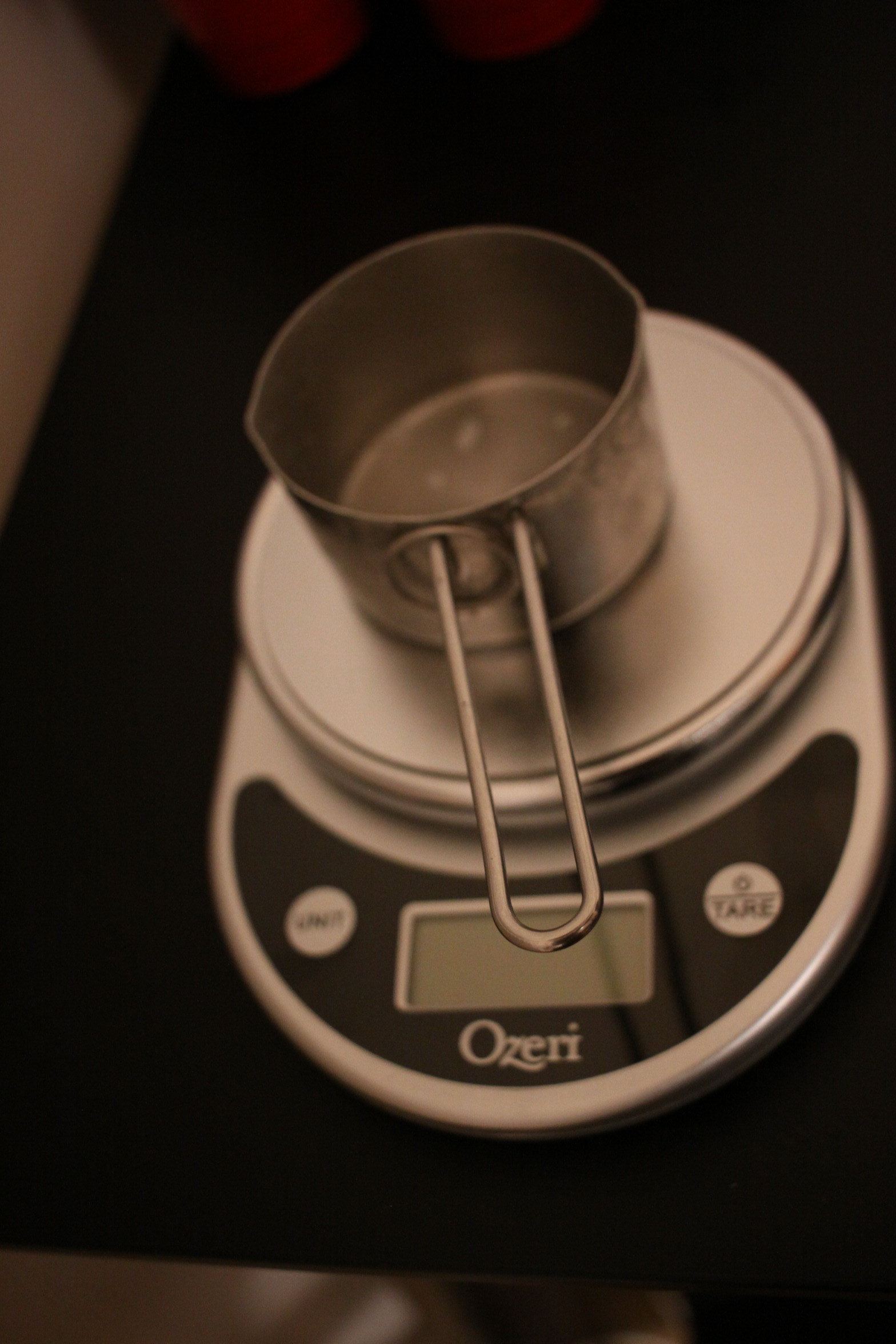 Cup measuring spoon on a measuring scale.